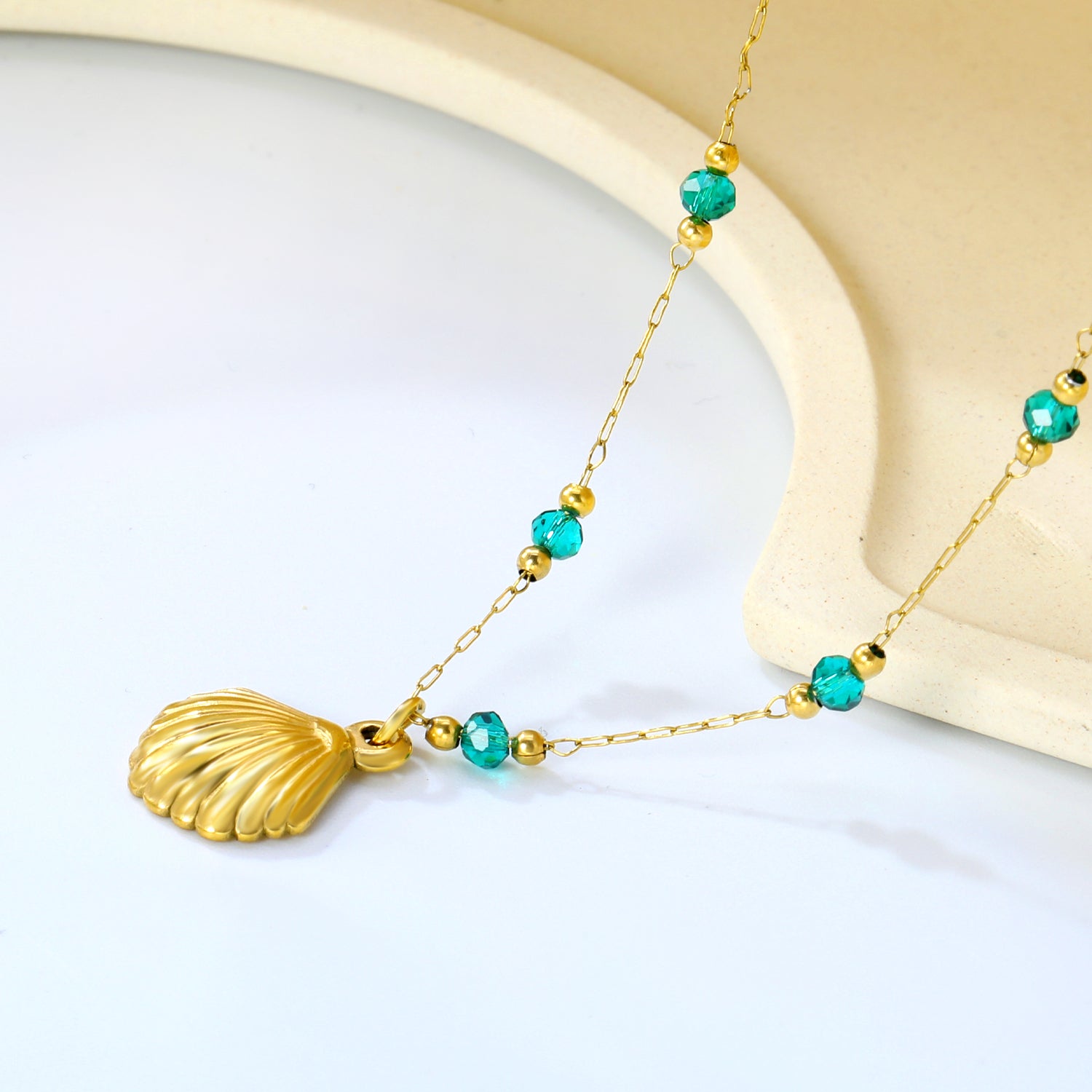 Gold Seashell Pendant Necklace with Green Beads