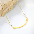 Dainty Gold Smile Bar Necklace with Heart Details