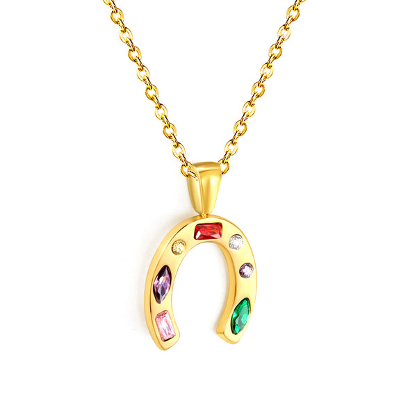 Gold horseshoe pendant necklace with colorful stones on a white background