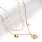 Layered Pearl Necklace with Seashell & Star Charms