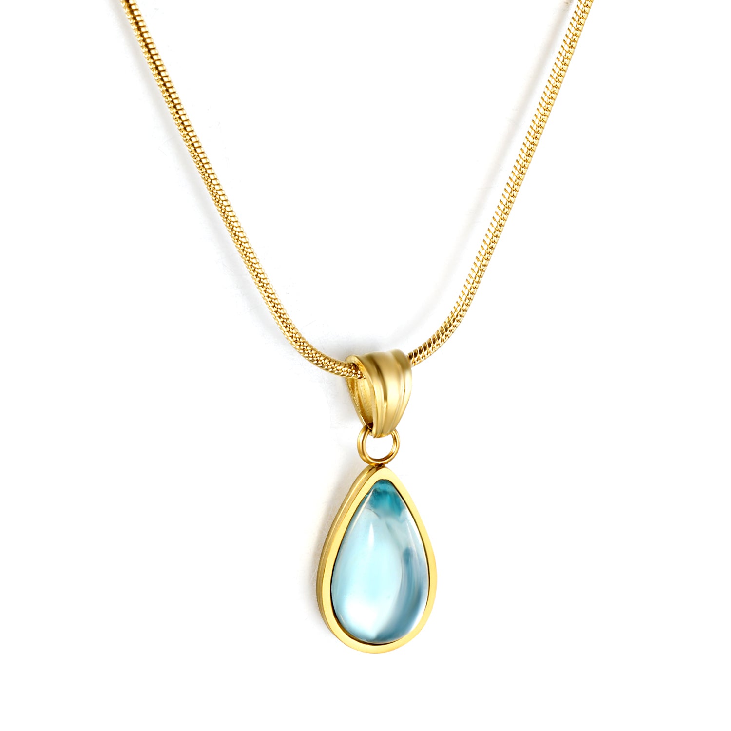 Gold necklace with a teardrop-shaped blue pendant on a white background