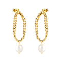Gold beaded earrings with pearl drops on a white background