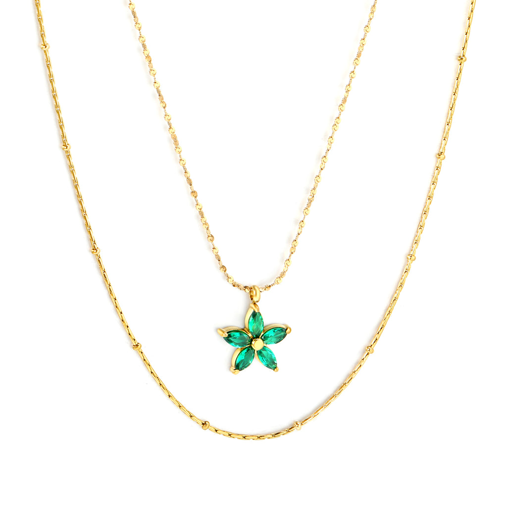18K Gold Plated on premium Stainless Steel, this necklace  is 100% waterproof, sweat-proof, and anti-tarnish. Designed for active women. Skin-friendly for the Chennai gym heat. Buy 2 Get 1 FREE! necklace with a green flower pendant on a white background