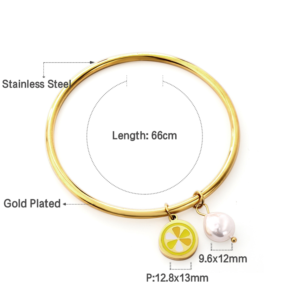 Gold bracelet with lemon and pearl charm, labeled for materials and measurements.