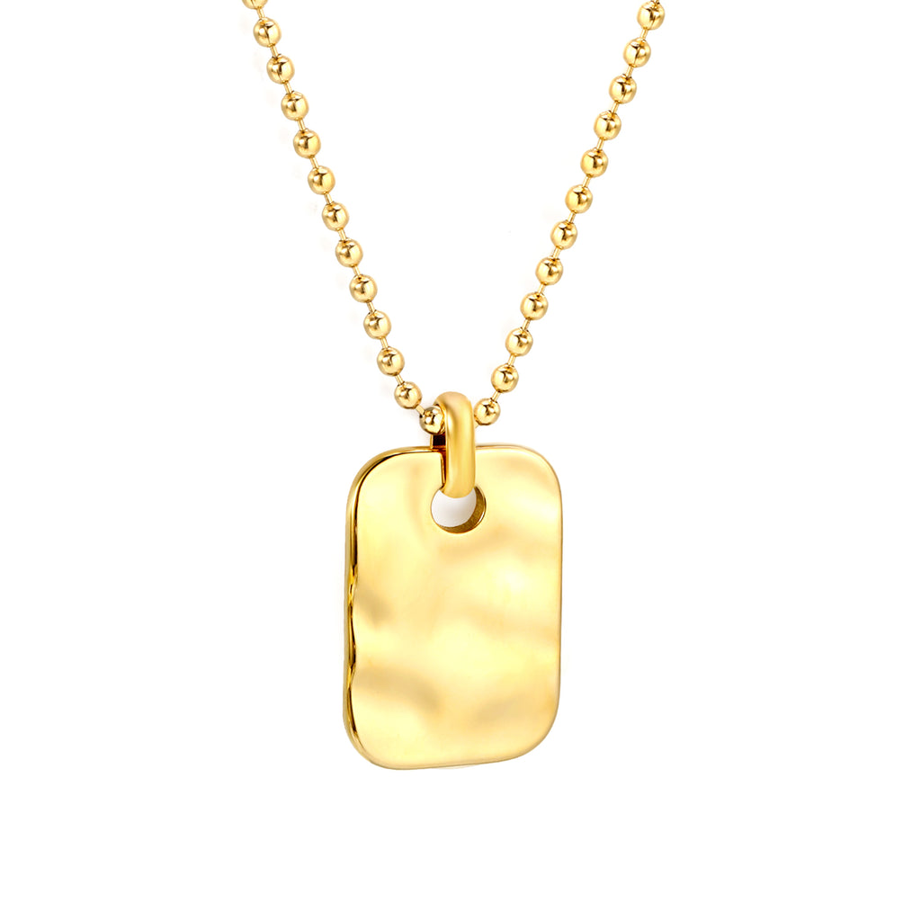 Gold necklace with a rectangular pendant on a white background