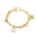 18k gold plated bracelet with shell and pearl charms on a white background | elazo