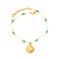 18k gold plated bracelet with shell charm and turquoise beads on a white background | elazo